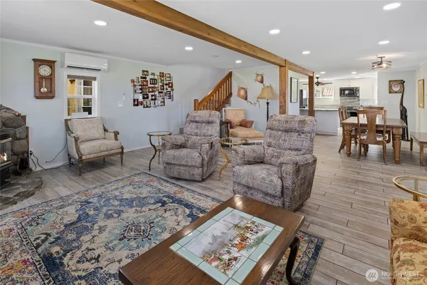 a living room with furniture and a rug