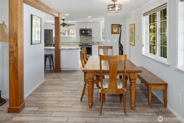 a view of a dining room with furniture and wooden floor