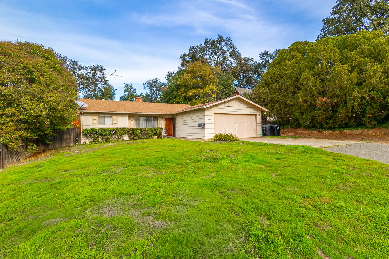 8643 Pershing Avenue Fair Oaks, CA 95628 - Photo 1 of 1 a view of a house with a yard and potted plants