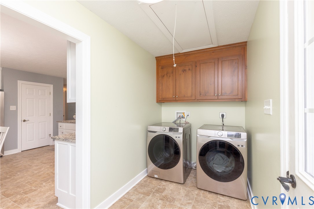 219 Pine Ridge Road Aylett, VA 23009 - Photo 18 of 38 Laundry room w/cabinetry and pull down attic!