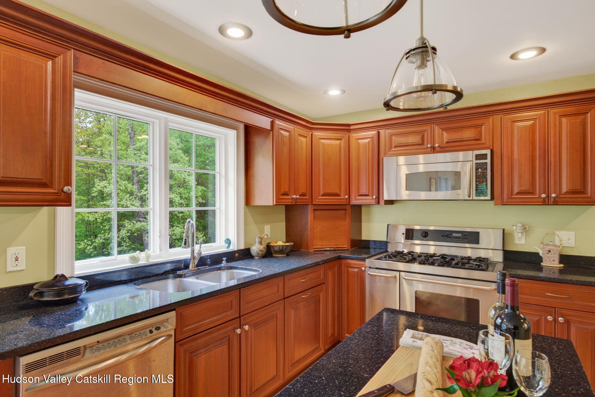 189 Bush Road Stone Ridge, NY 12484 - Photo 16 of 60 a kitchen with a sink stove and cabinets