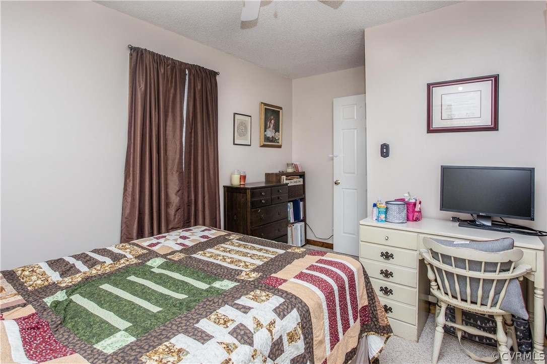 7487 Trailing Rock Road Prince George, VA 23875 - Photo 30 of 33 a bedroom with a bed and a desk
