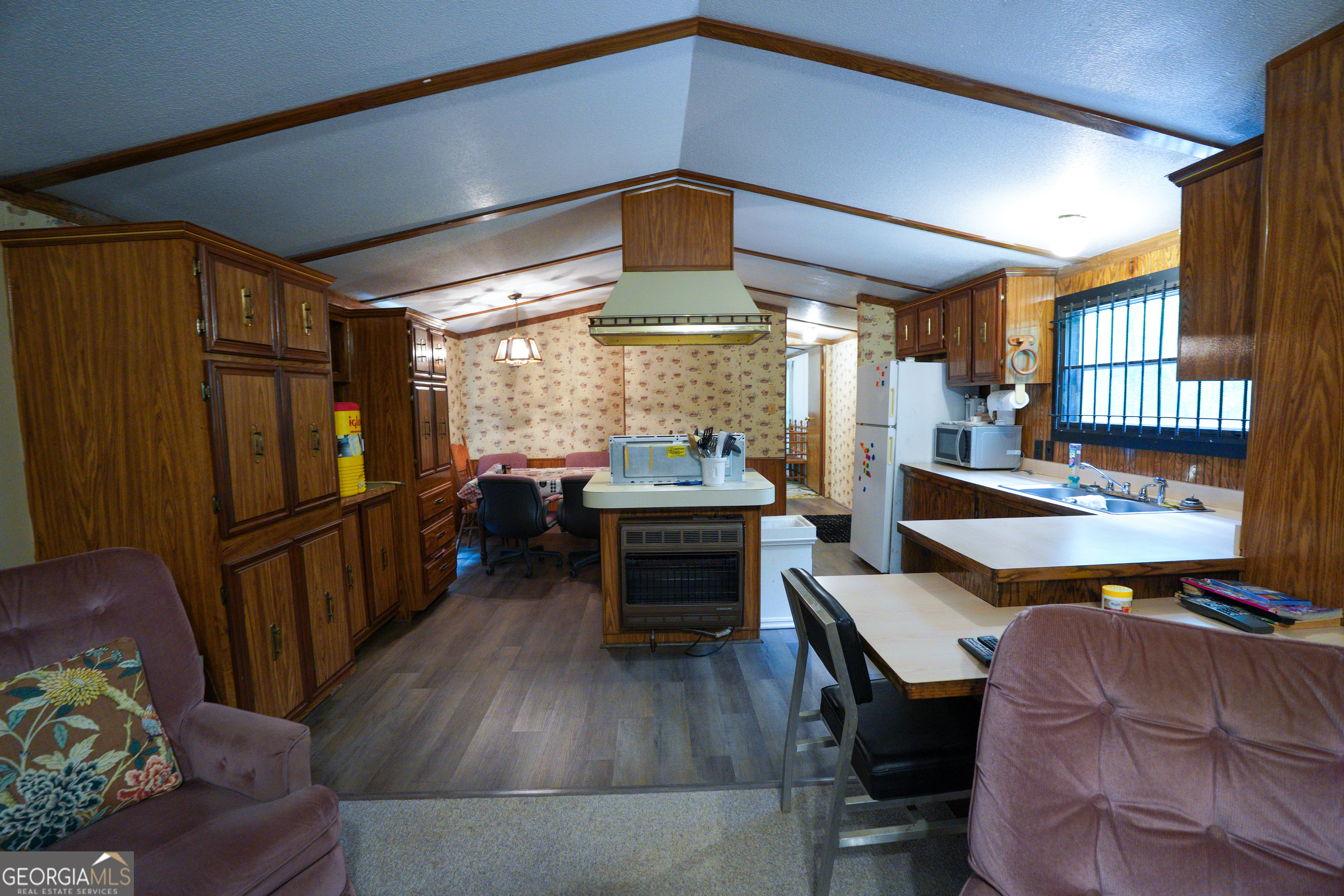1099 Dixon Road Sparta, GA 31087 - Photo 20 of 51 a living room with furniture and a wooden floor