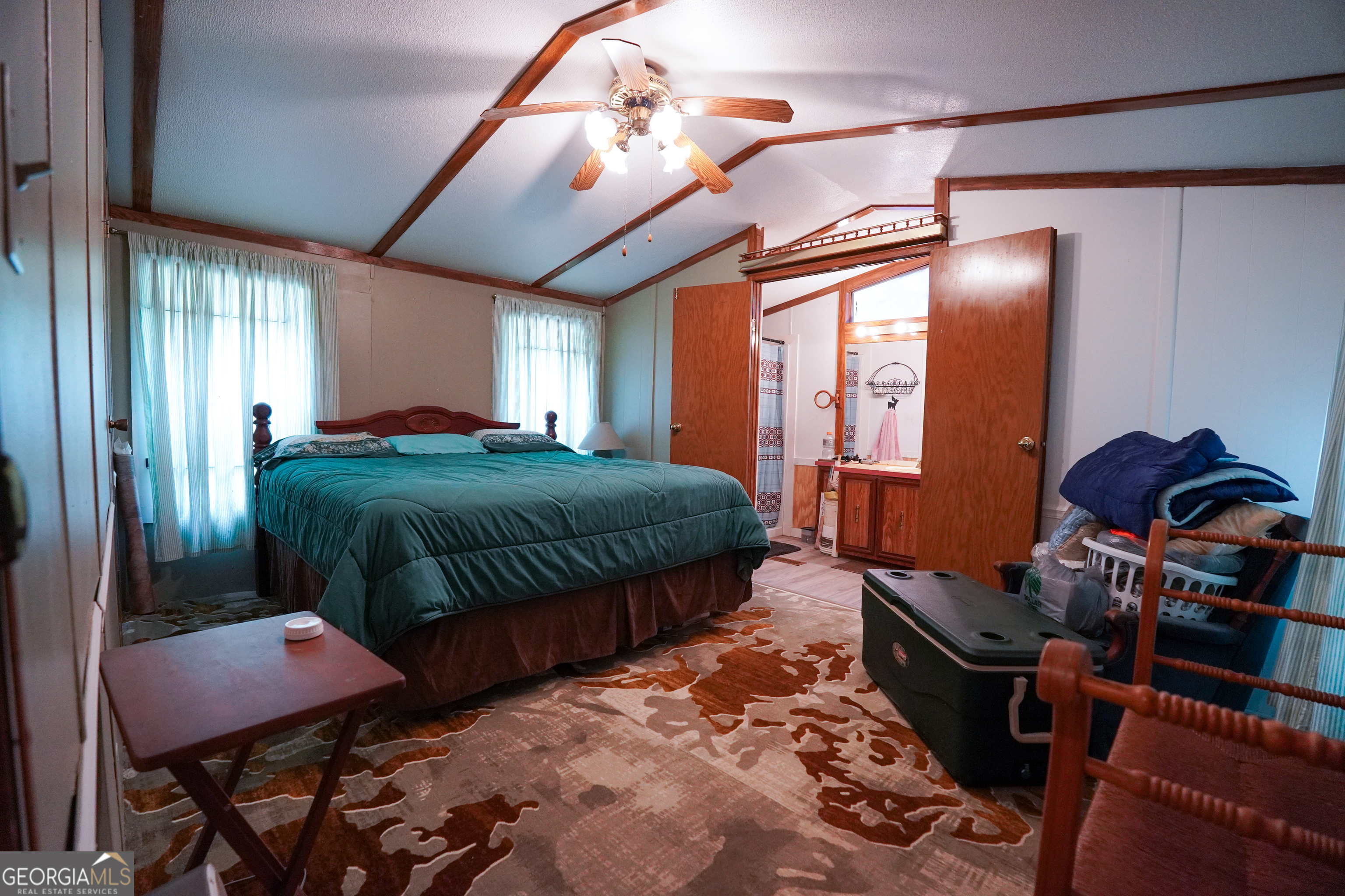 1099 Dixon Road Sparta, GA 31087 - Photo 21 of 51 a bedroom with furniture and a mirror