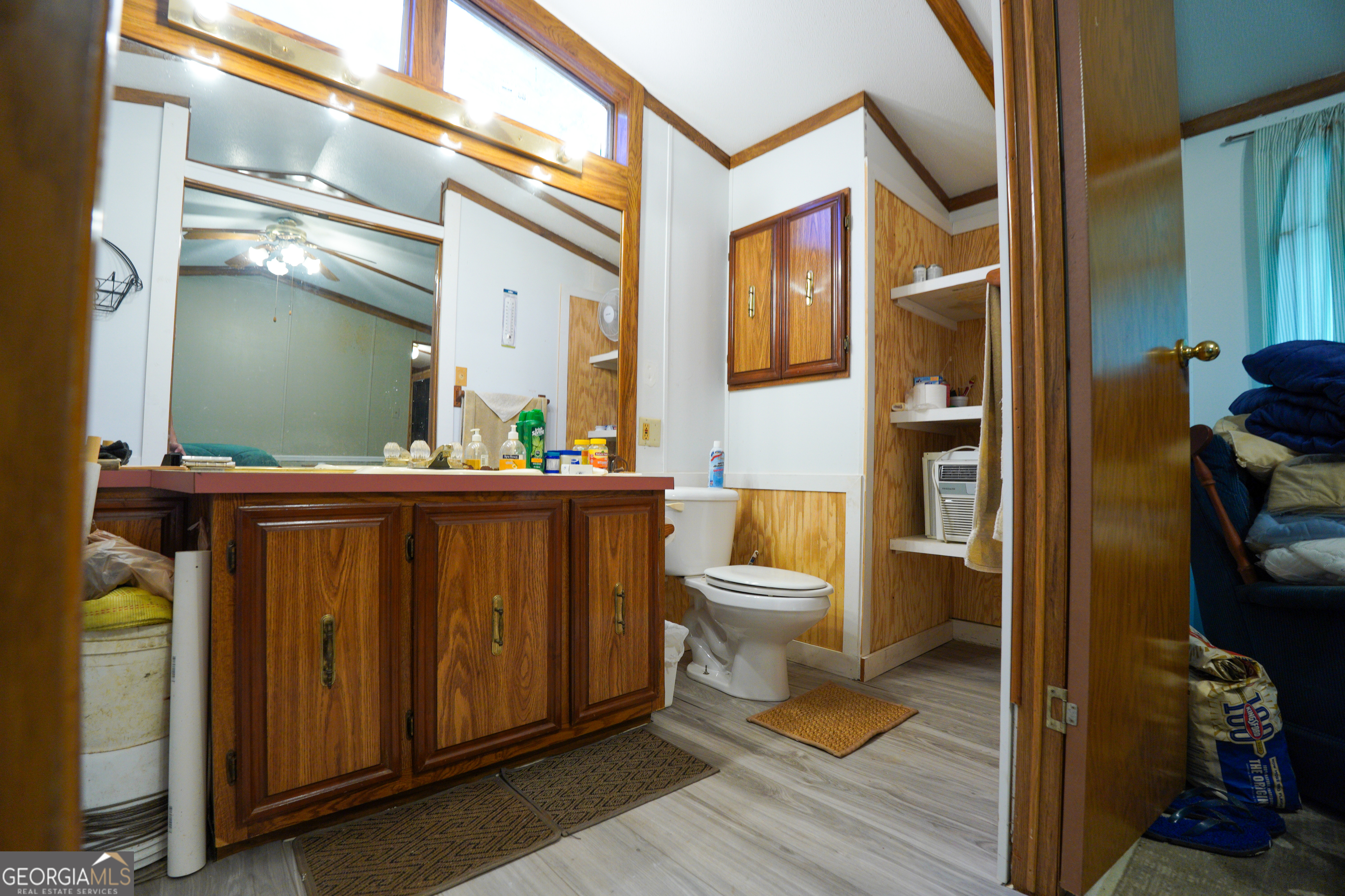 1099 Dixon Road Sparta, GA 31087 - Photo 23 of 51 a bathroom with a toilet sink and mirror