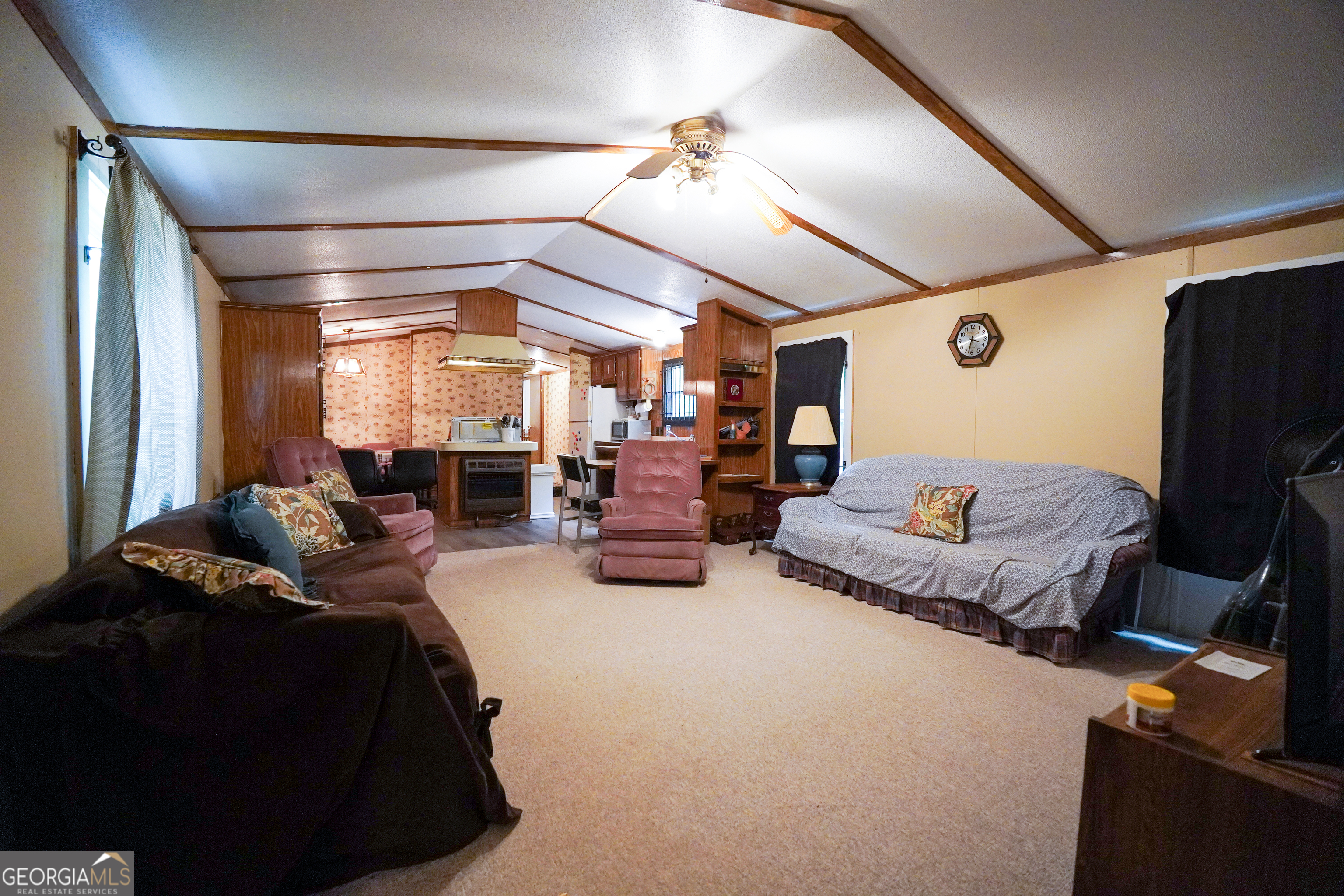 1099 Dixon Road Sparta, GA 31087 - Photo 25 of 51 a bed room with furniture and a chandelier