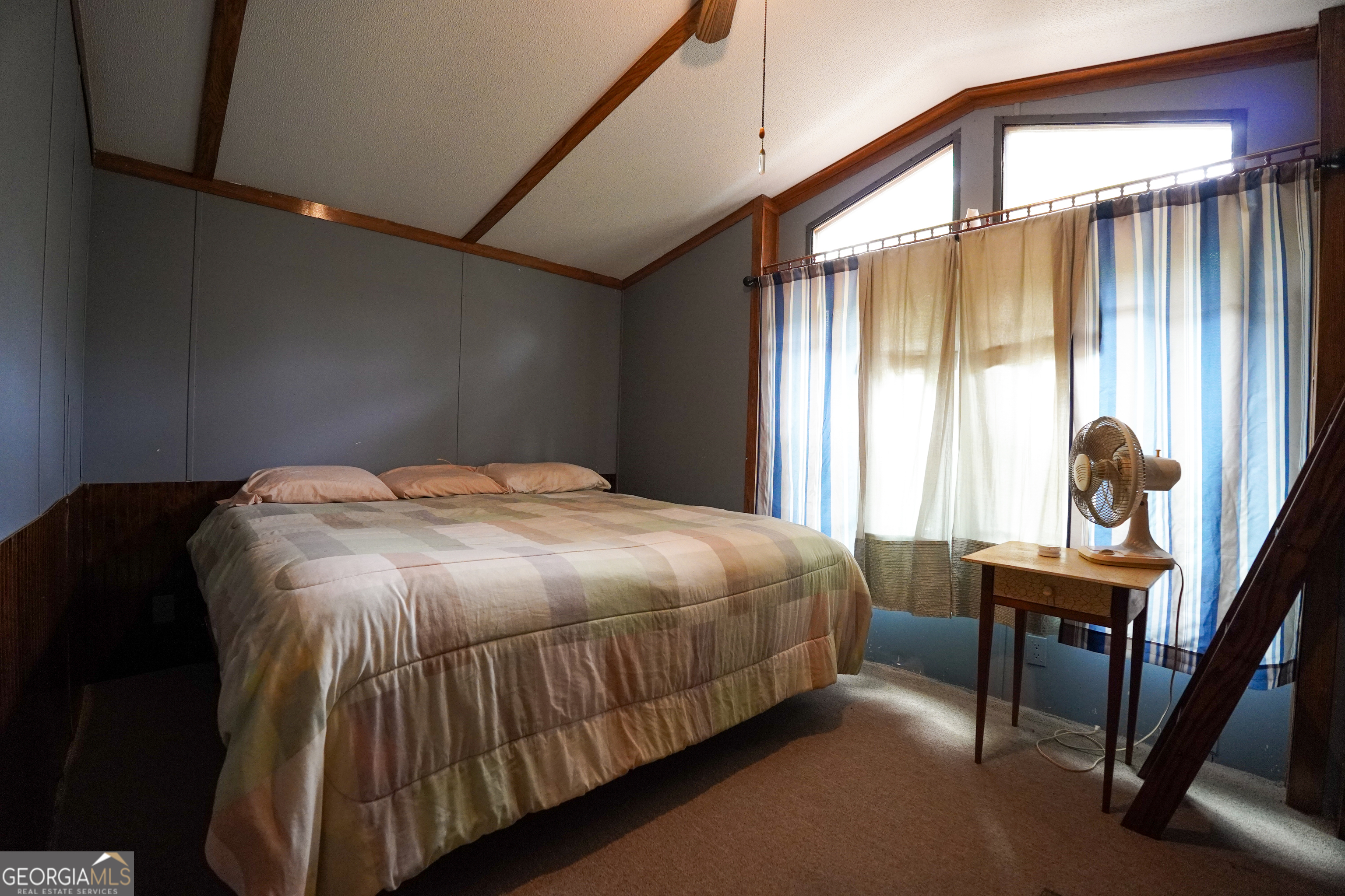 1099 Dixon Road Sparta, GA 31087 - Photo 26 of 51 a bedroom with a bed and a window
