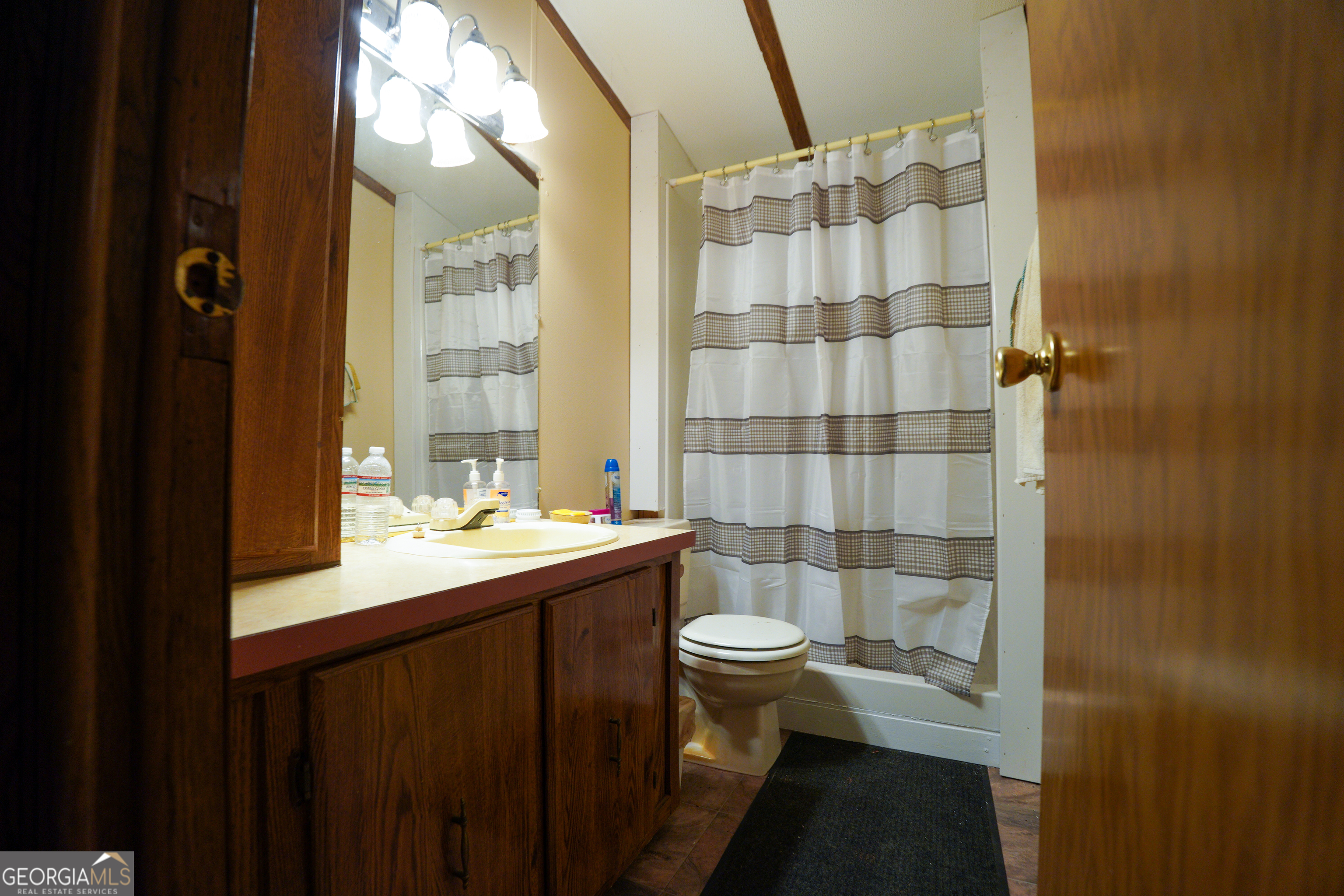1099 Dixon Road Sparta, GA 31087 - Photo 28 of 51 a bathroom with a sink and a mirror