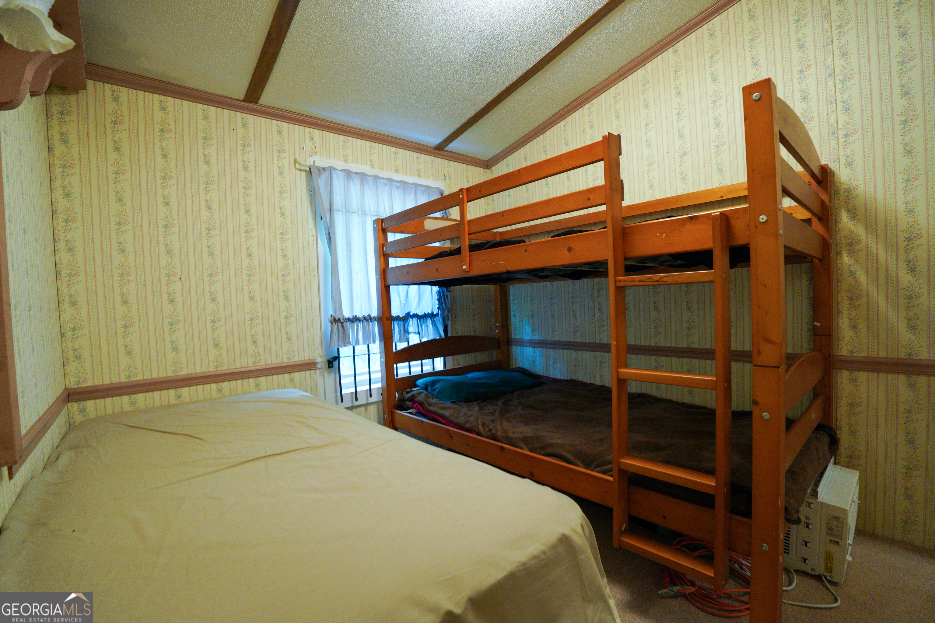 1099 Dixon Road Sparta, GA 31087 - Photo 29 of 51 a bedroom with a bed and a ceiling fan