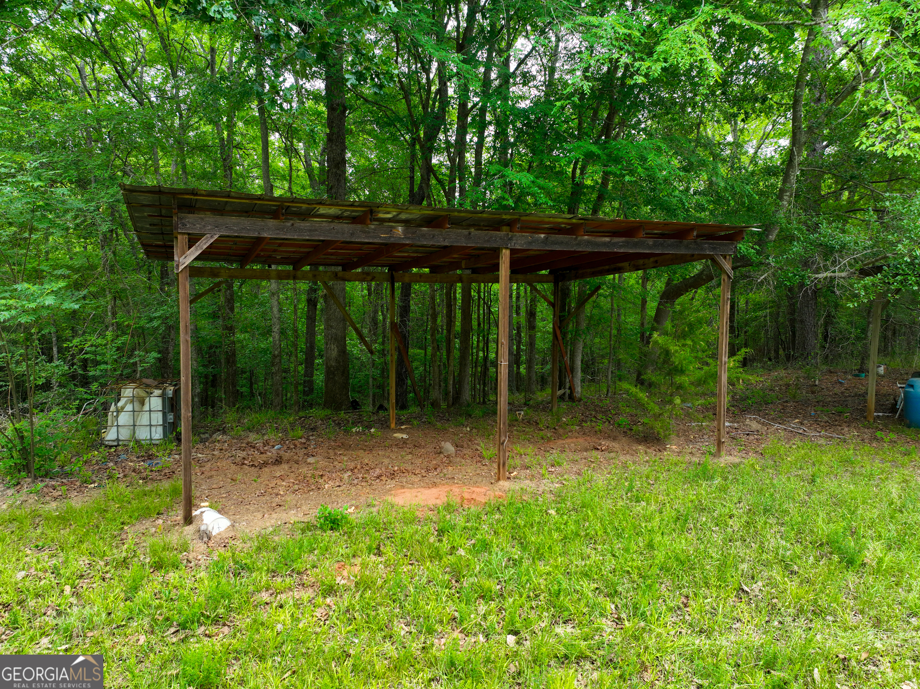 1099 Dixon Road Sparta, GA 31087 - Photo 33 of 51 a view of backyard with green space and deck