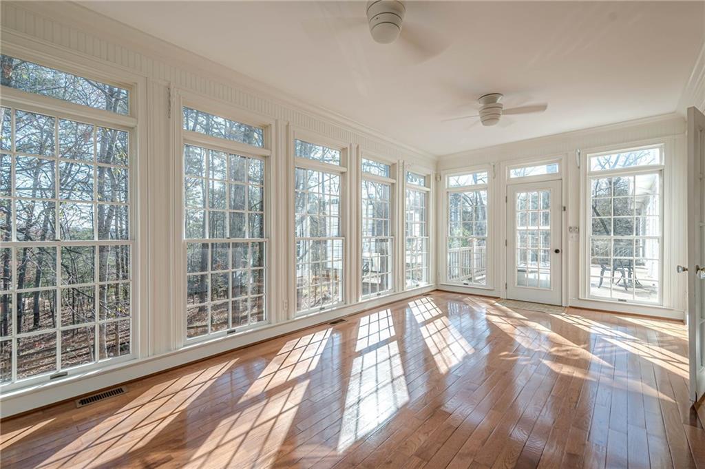 34 Johnston Row Northwest Cartersville, GA 30121 - Photo 20 of 95 a view of an empty room with wooden floor and a window