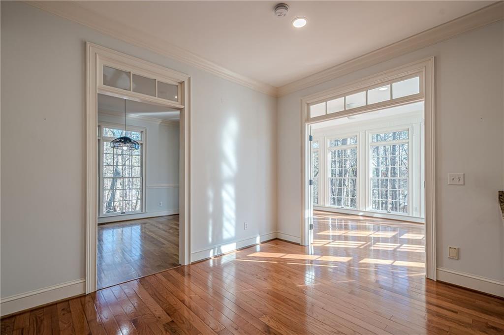 34 Johnston Row Northwest Cartersville, GA 30121 - Photo 31 of 95 an empty room with wooden floor and windows