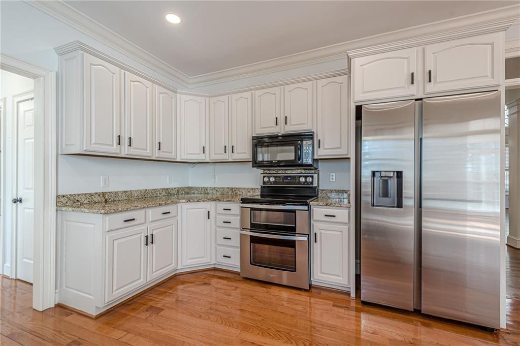 34 Johnston Row Northwest Cartersville, GA 30121 - Photo 38 of 95 a kitchen with cabinets stainless steel appliances and a counter space