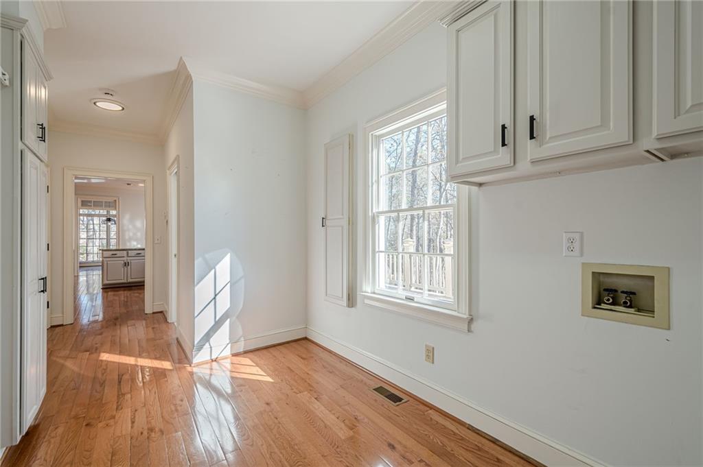 34 Johnston Row Northwest Cartersville, GA 30121 - Photo 39 of 95 a view of empty room with wooden floor and cabinets