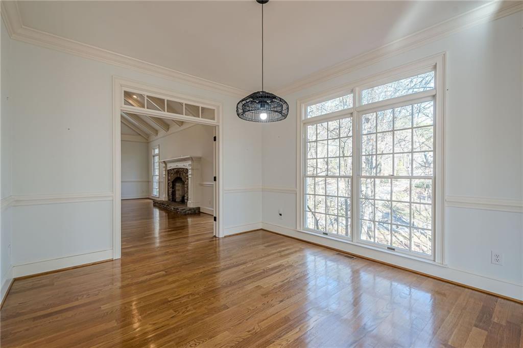 34 Johnston Row Northwest Cartersville, GA 30121 - Photo 41 of 95 a view of an empty room with wooden floor and a window