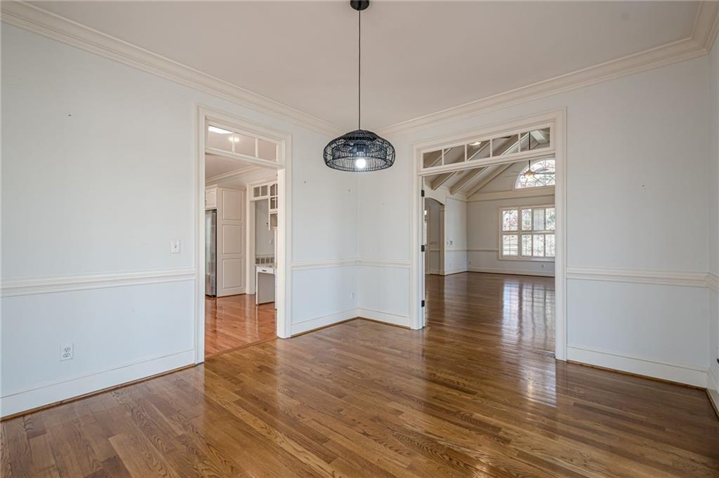 34 Johnston Row Northwest Cartersville, GA 30121 - Photo 42 of 95 a view of an empty room with wooden floor and a window