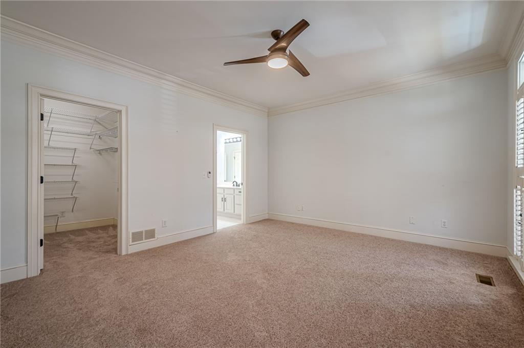 34 Johnston Row Northwest Cartersville, GA 30121 - Photo 44 of 95 an empty room with closet and a ceiling fan