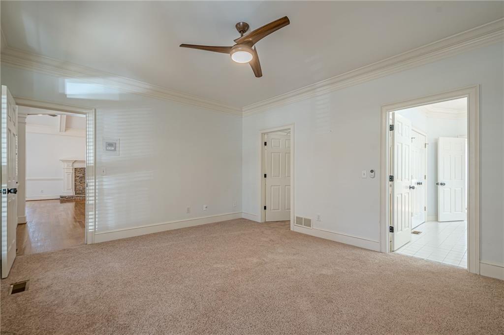 34 Johnston Row Northwest Cartersville, GA 30121 - Photo 45 of 95 an empty room with closet and a ceiling fan