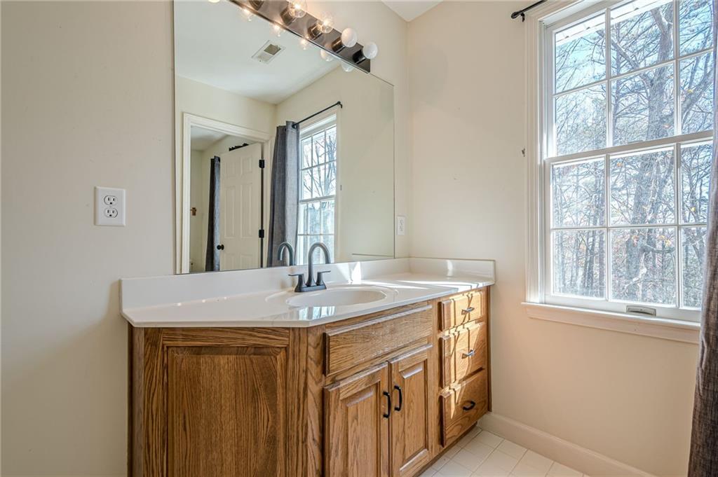 34 Johnston Row Northwest Cartersville, GA 30121 - Photo 60 of 95 a bathroom with a granite countertop sink and a mirror