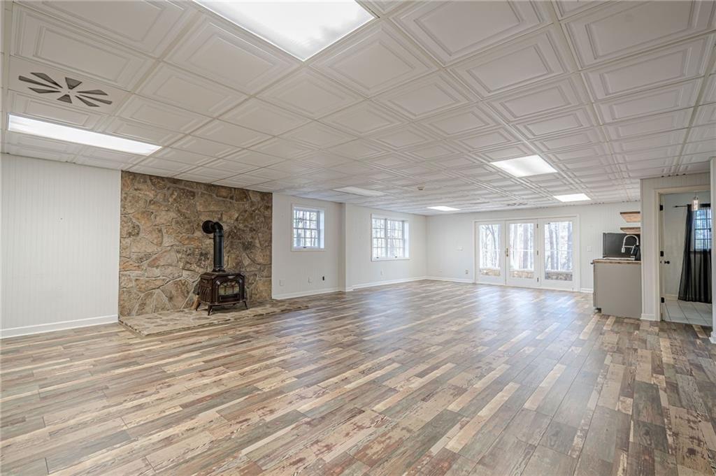 34 Johnston Row Northwest Cartersville, GA 30121 - Photo 69 of 95 a view of an empty room with window and wooden floor
