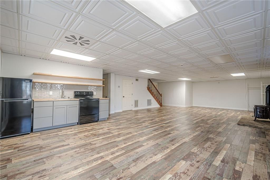 34 Johnston Row Northwest Cartersville, GA 30121 - Photo 71 of 95 a view of a kitchen with a sink and a stove top oven