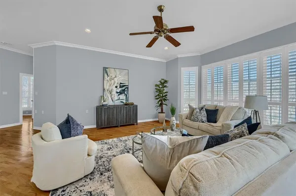 a living room with furniture and a window