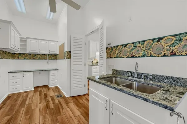 a kitchen with a sink and cabinets