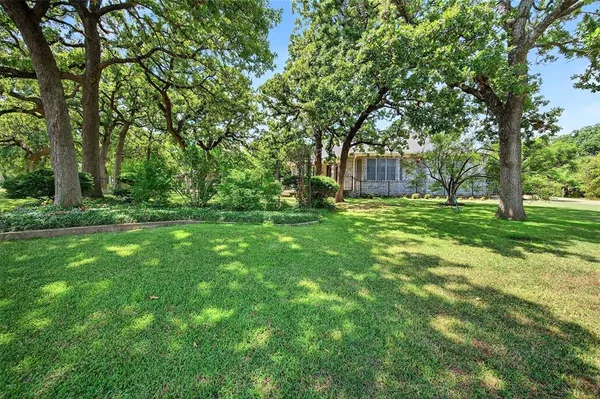 a backyard of a house with lots of green space