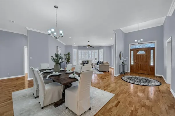 a very nice looking dining room with a table and chairs