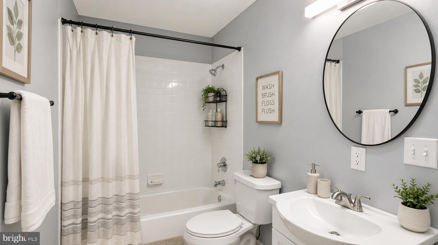 4203 Shell Street Capitol Heights, MD 20743 - Photo 34 of 47 a bathroom with a toilet a sink and a mirror