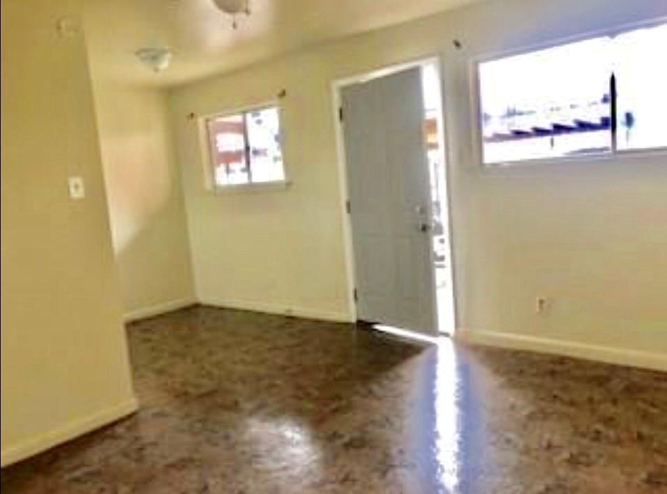 1755 Colquitt Street, Unit 7 Houston, TX 77098 - Photo 14 of 20 an empty room with wooden floor and windows