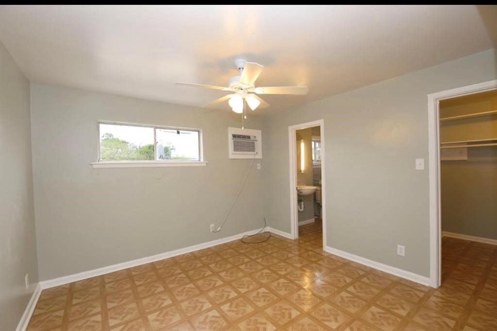 1755 Colquitt Street, Unit 7 Houston, TX 77098 - Photo 18 of 20 a view of an empty room with a window