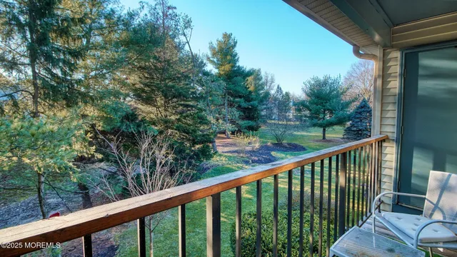 a balcony with trees in front of it