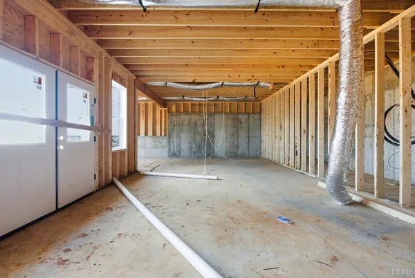 a view of an empty room with windows