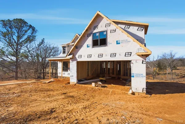 a view of a white house with a large space