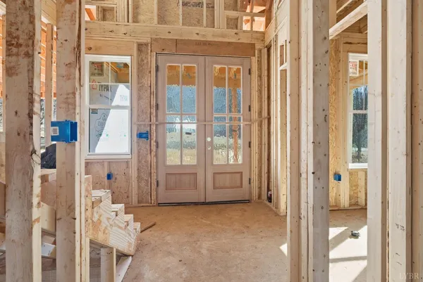 a view of a brick house with large windows