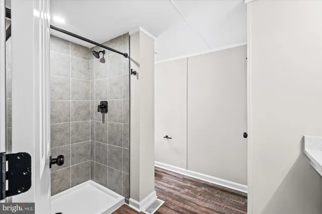 a white toilet sitting next to a bathroom sink