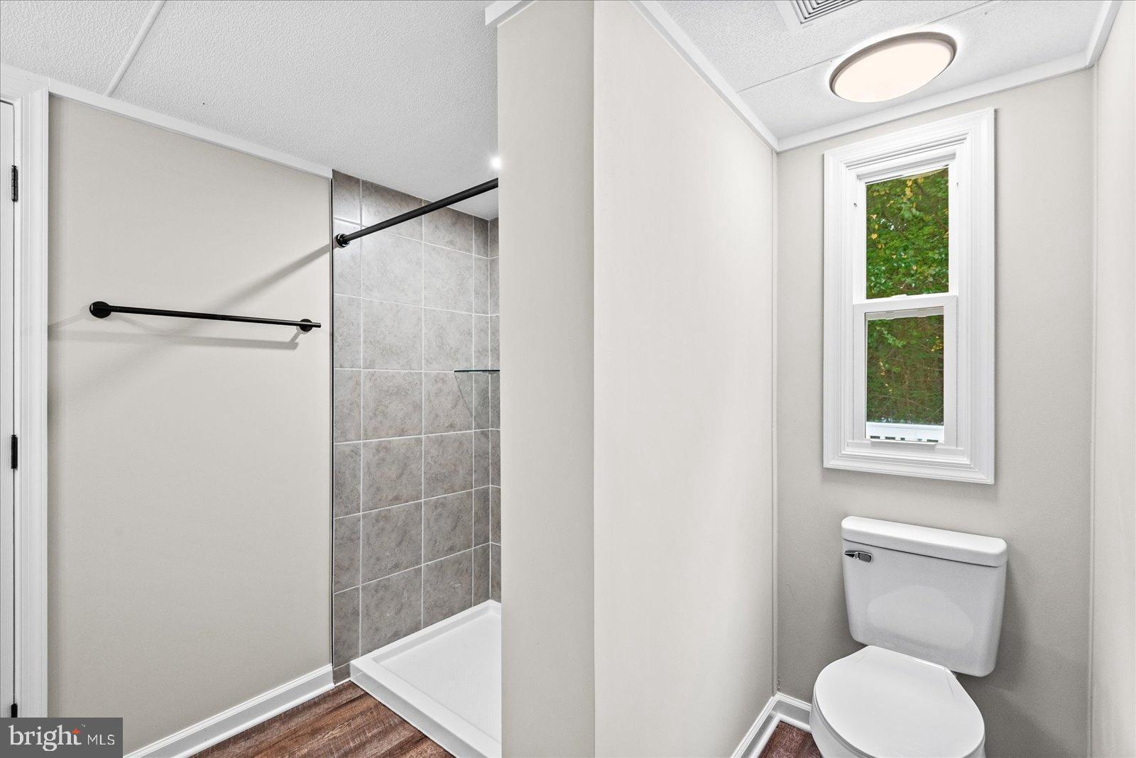 20105 Sparta Road Milford, VA 22514 - Photo 12 of 48 a white toilet sitting next to a bathroom sink