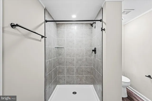 a kitchen with stainless steel appliances a refrigerator sink and cabinets