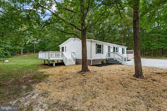 a house with trees in the background
