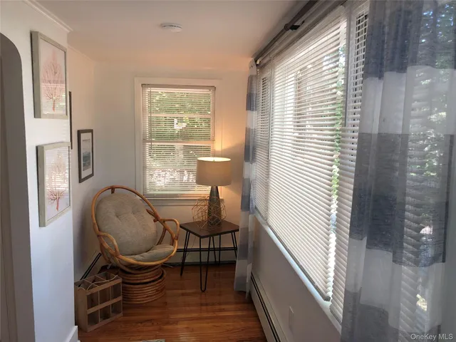 a room with chairs and windows