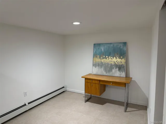a room with furniture and painting on a wall