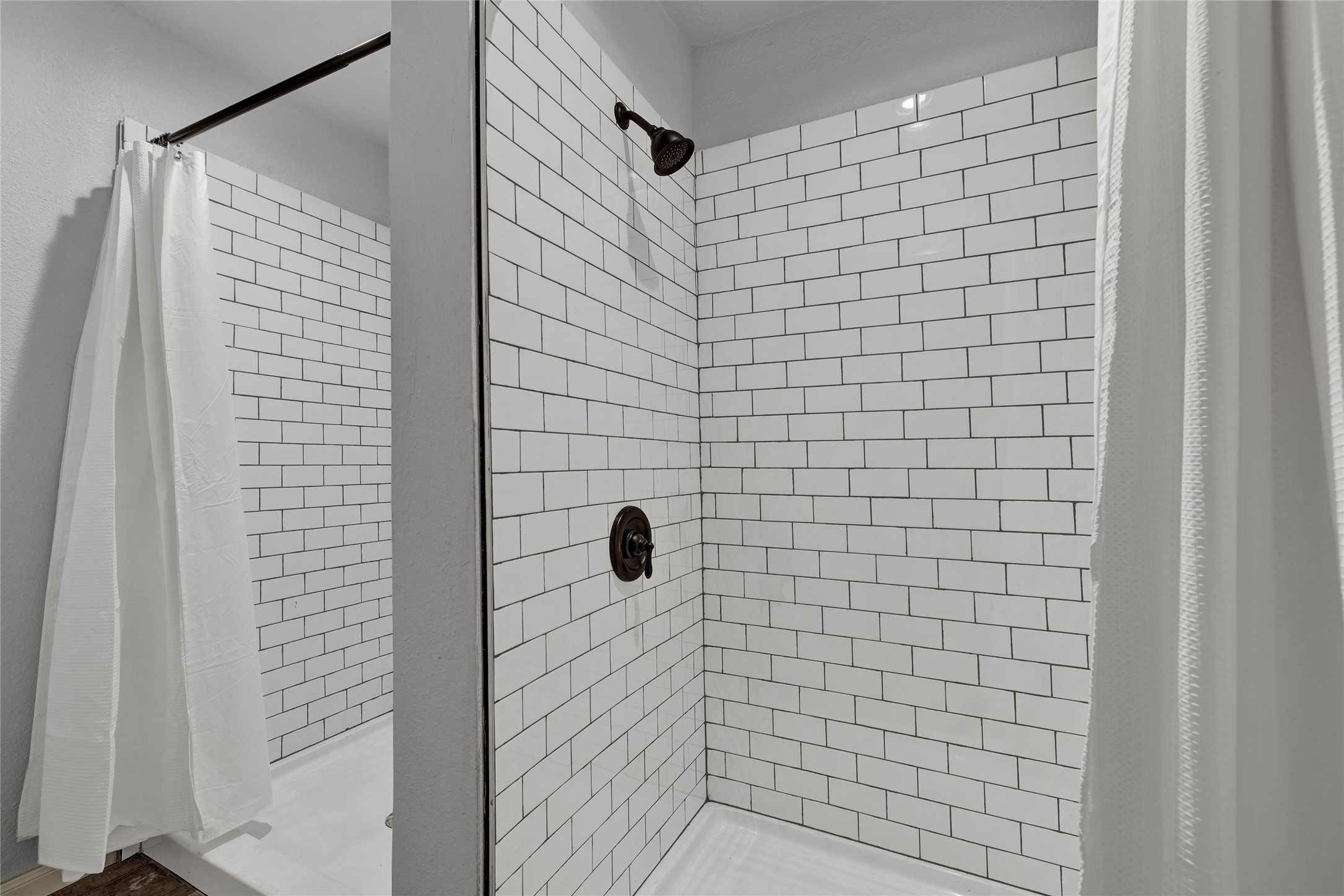 157 Kurt Kramer Road Fredericksburg, TX 78624 - Photo 27 of 38 Dual walk-in showers allow space for multiple people to get ready at once.