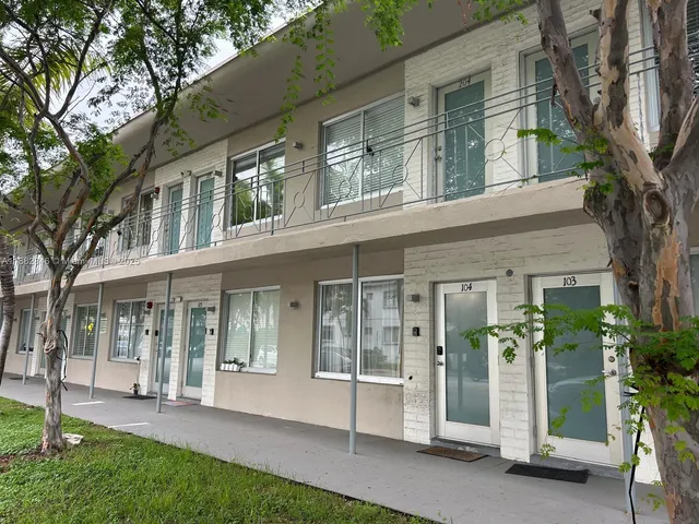 front view of a house with a garden