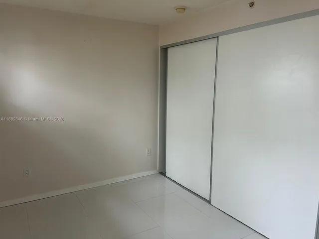 an empty room with a bench