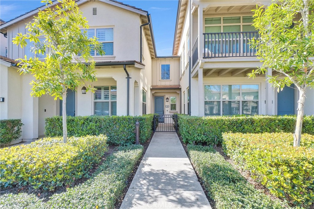 a view of a brick building next to a yard