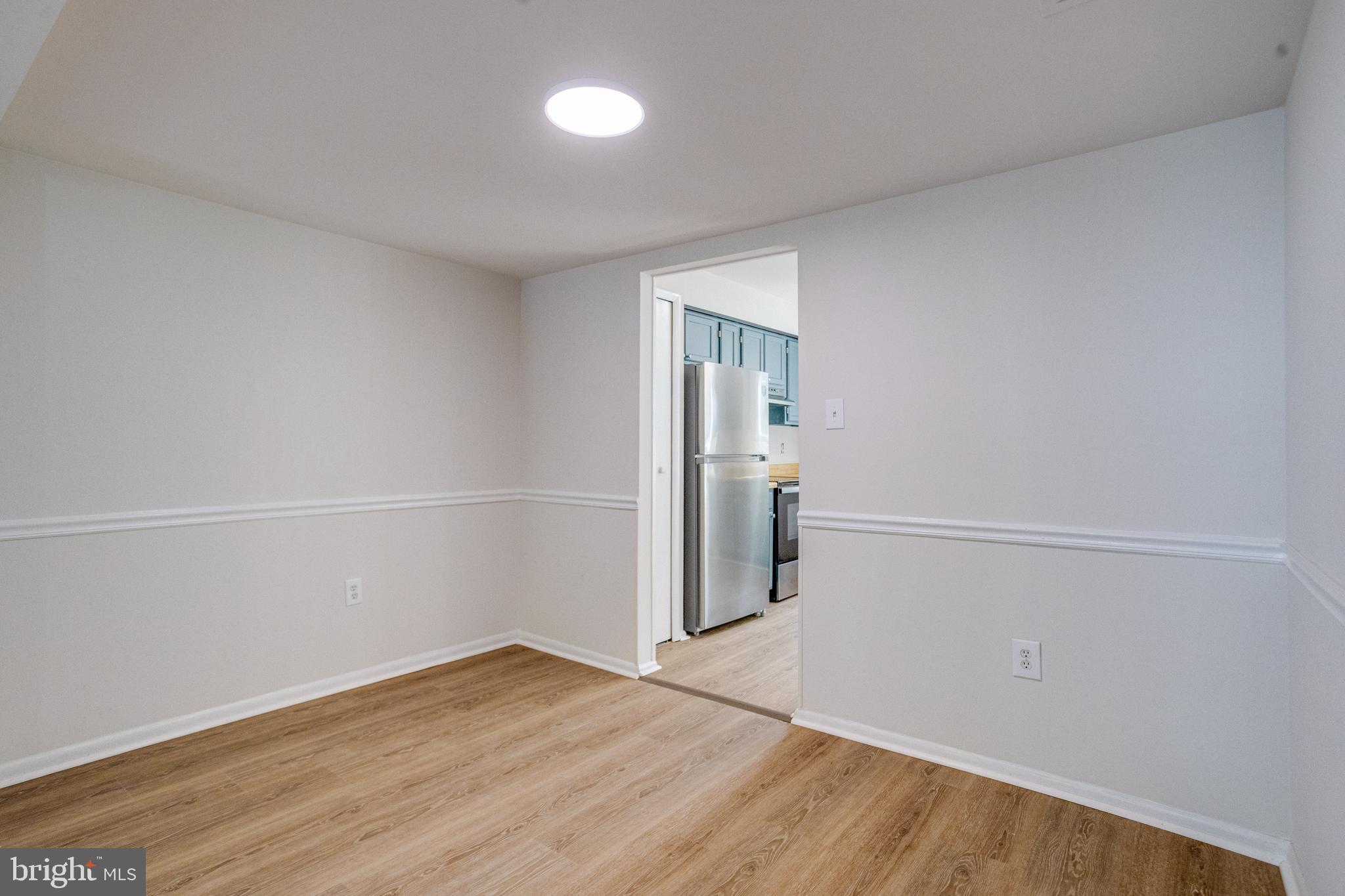 15925 Dorset Road, Unit 199 Laurel, MD 20707 - Photo 11 of 50 a view of empty room with wooden floor