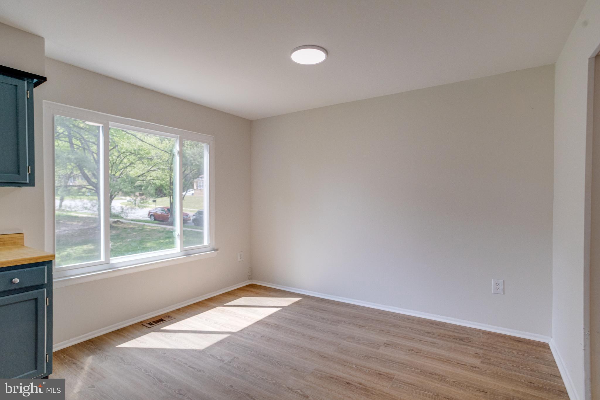 15925 Dorset Road, Unit 199 Laurel, MD 20707 - Photo 14 of 50 a view of empty room with wooden floor and fan