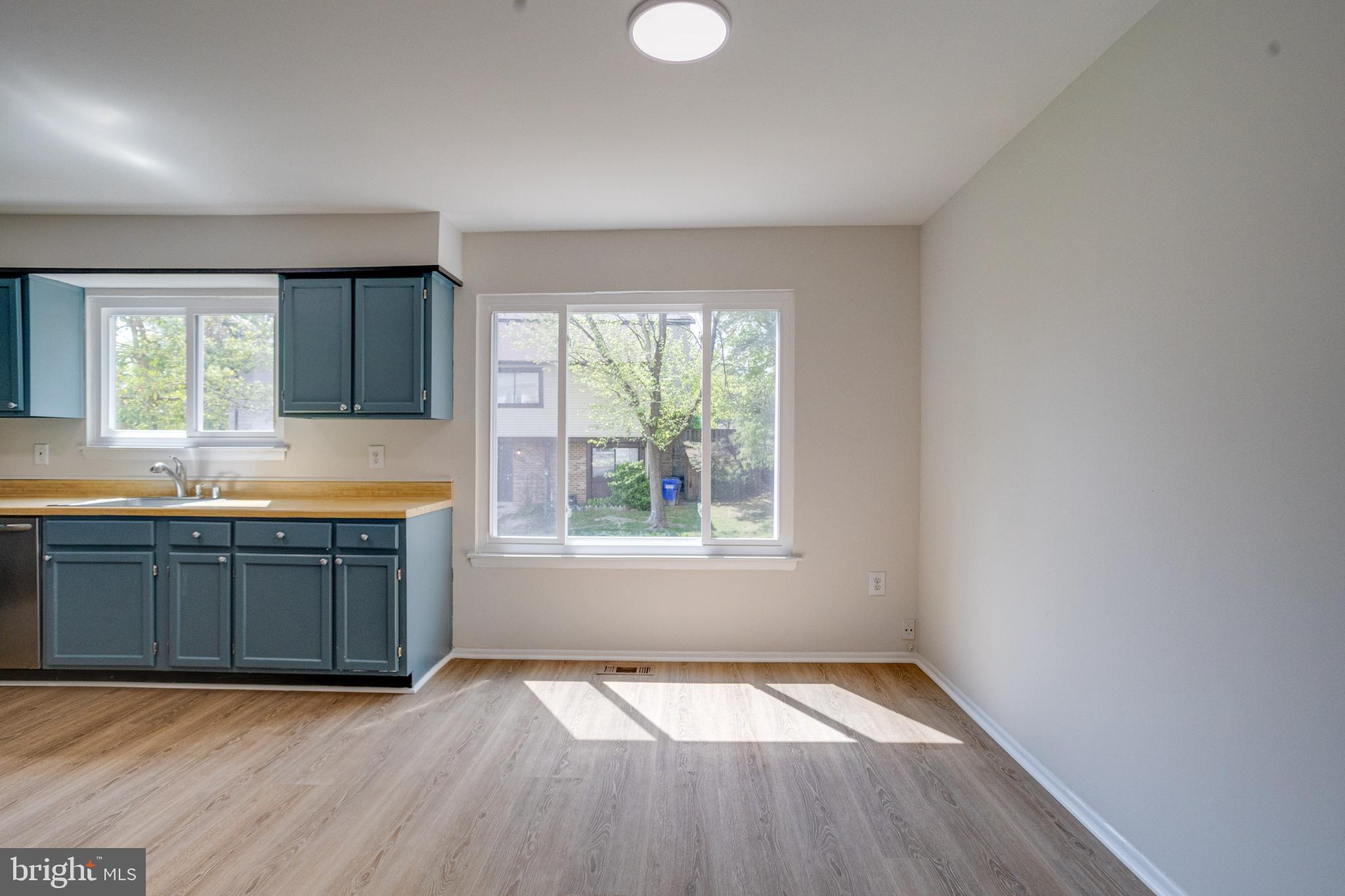 15925 Dorset Road, Unit 199 Laurel, MD 20707 - Photo 18 of 50 an empty room with wooden floor and a window