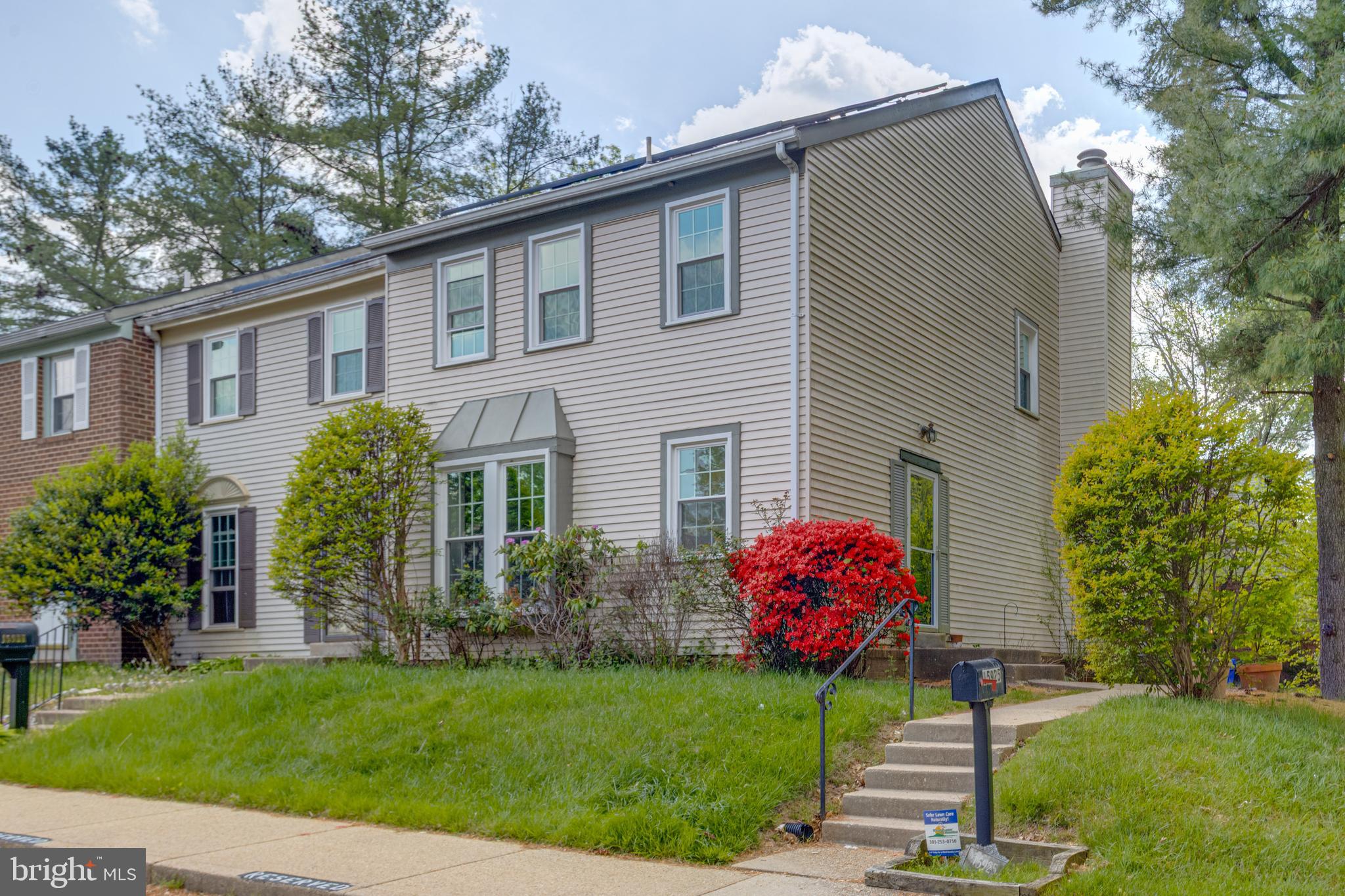 15925 Dorset Road, Unit 199 Laurel, MD 20707 - Photo 2 of 50 a front view of a house with garden